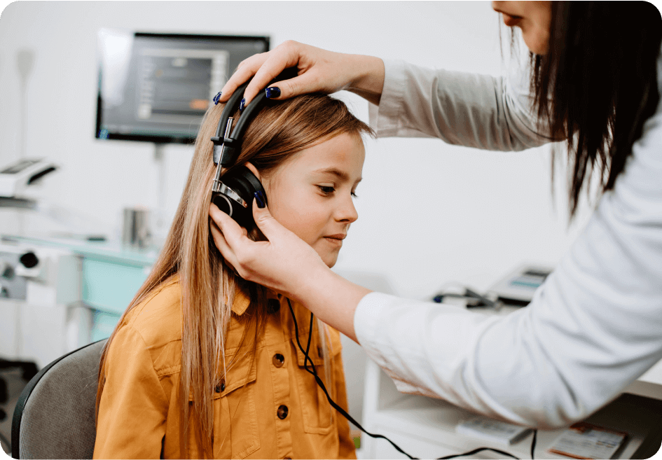 Aya Education girl with hearing device