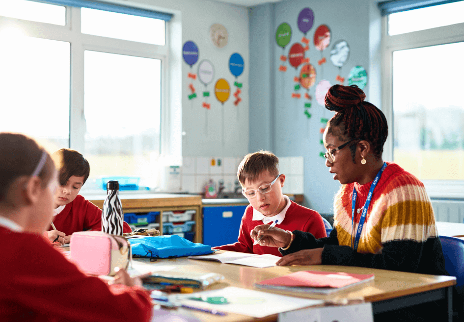 Aya Education a teacher in a classroom with children