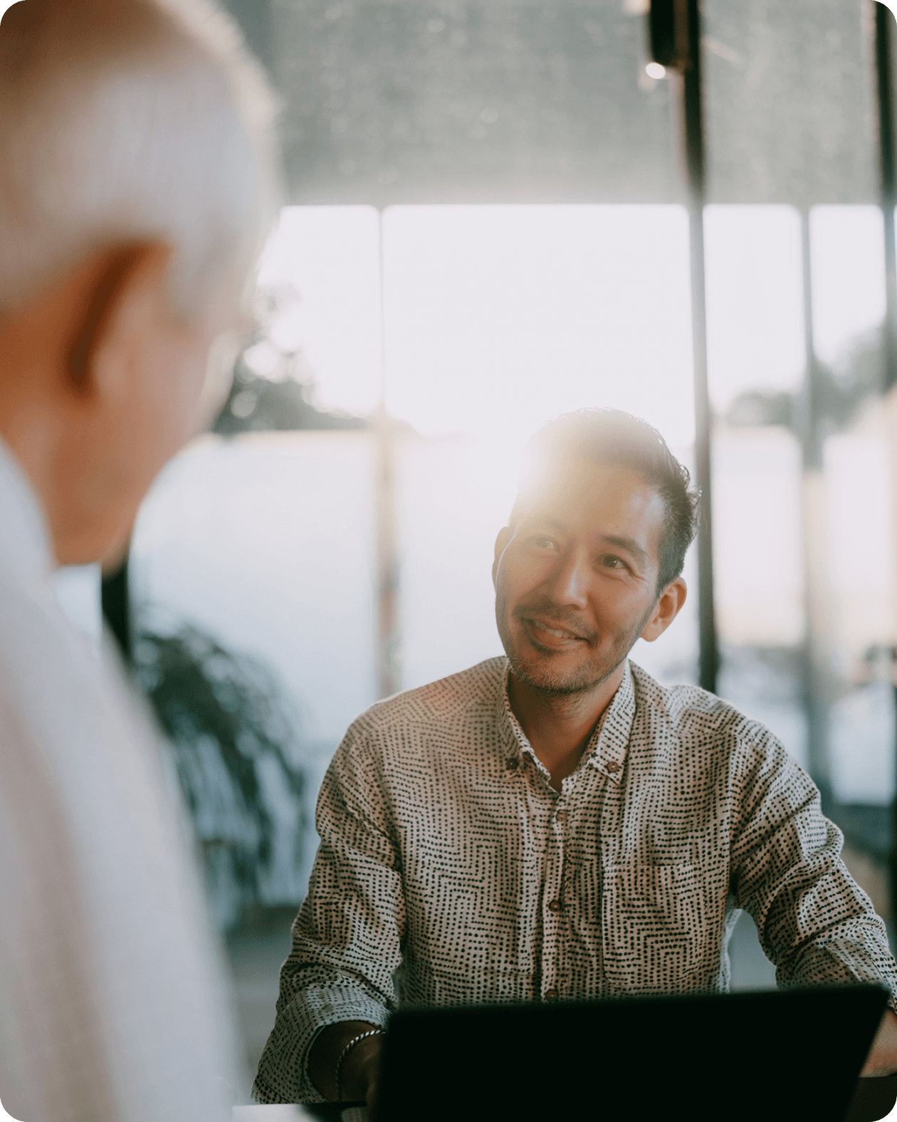 Aya Education woman working on laptop